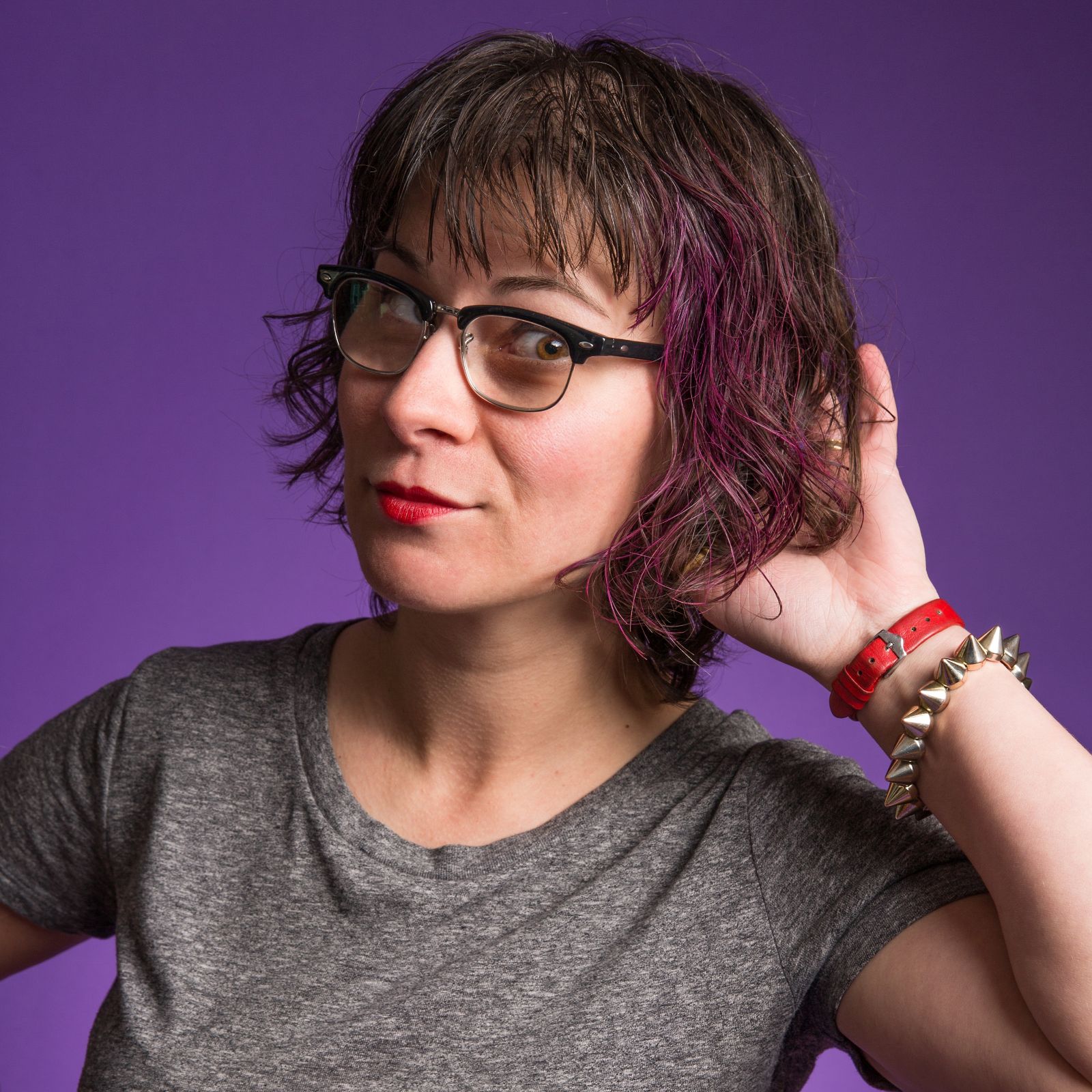 Rachel's headshot with a purple background.